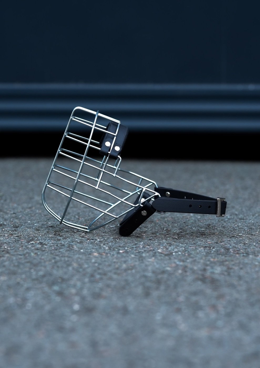 A wire basket muzzle designed for training a dog